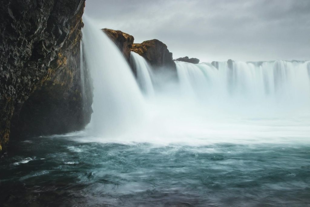 Breathtaking scene of the Goðafoss waterfall in Iceland, showcasing its powerful and serene flow.