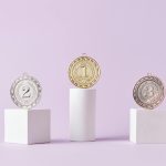 What Is Ranked Mode in Games and How It Affects Player Progress Medals on a podium against a soft pastel background, ideal for awards themes.