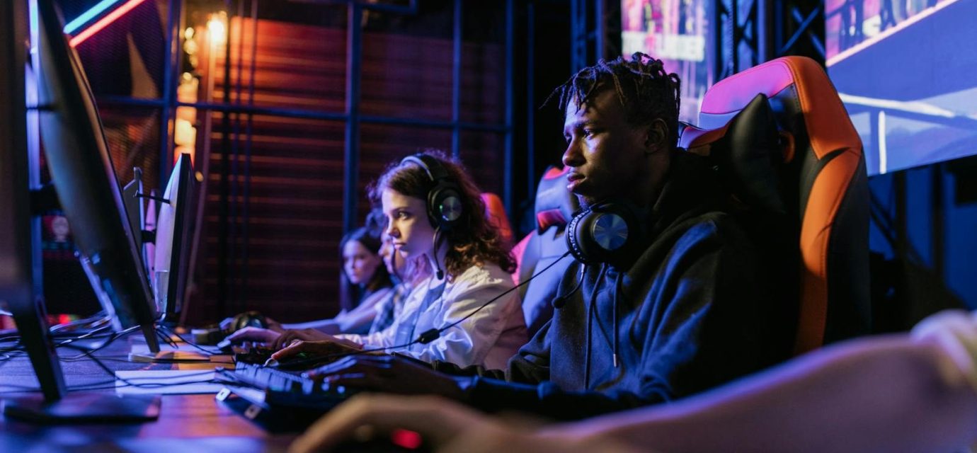 Serious gamers engage in a competitive esports event, highlighting focus and teamwork.