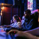 How Esports Tournaments Work From Qualifiers to Finals Explained Serious gamers engage in a competitive esports event, highlighting focus and teamwork.