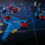 A strategic board game featuring a world map and colorful playing pieces.